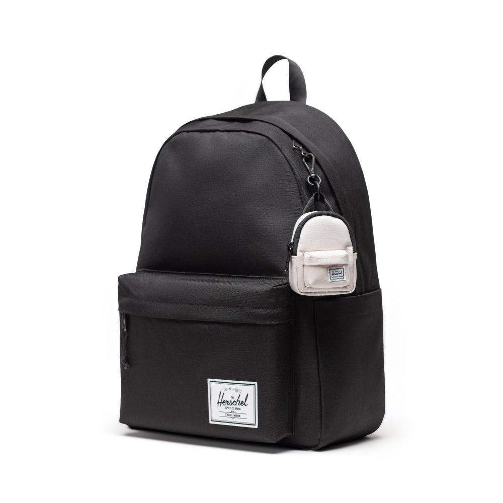 Herschel Classic Backpack Bag Charm Moonbeam Clipped On A Black Bag