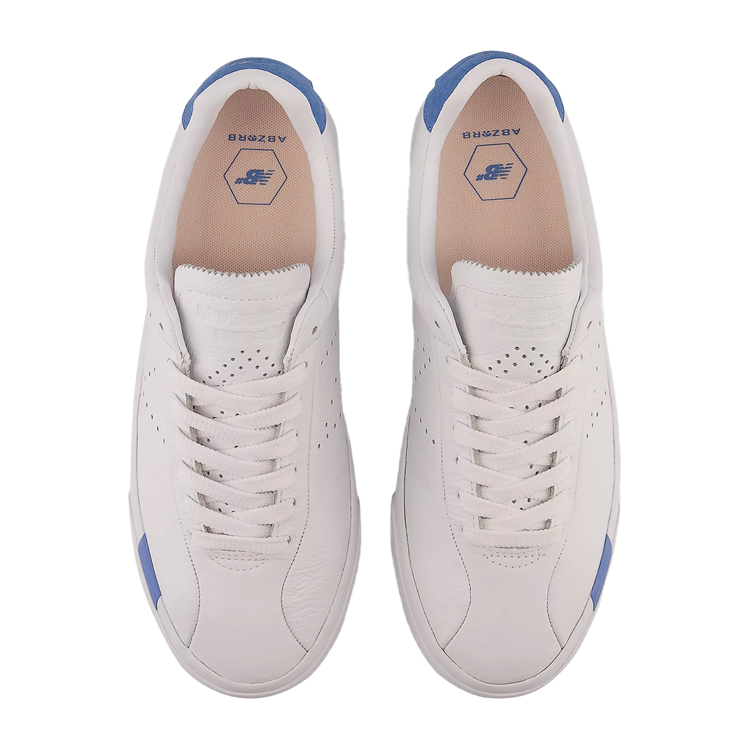 New Balance Numeric 22 White with Blue - Shoes The NM22 from New Balance Numeric is the skateboarding version of the Tempus indoor soccer shoe from the New Balance archives. Featuring a classic T-toe construction, but with a stitch and turn seam for added durability, the NM22 sits on a tried and true NB# vulcanized sole. The minimalistic detailing and the custom molded ABZORB insole provide a clean and classic aesthetic while not compromising on fit and comfort