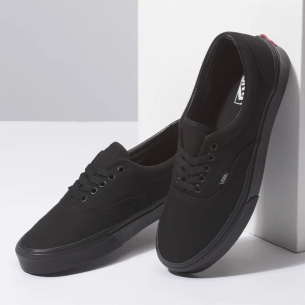 Vans Era Black / Black Shoes On The Wall