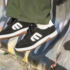Etnies Locut Shoes Black Lifestyle Sitting Down