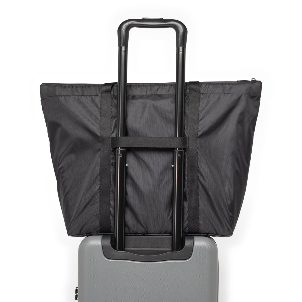 Herschel Portland Packable Tote Bag Black Tonal Back View On Luggage