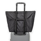 Herschel Portland Packable Tote Bag Black Tonal Back View On Luggage