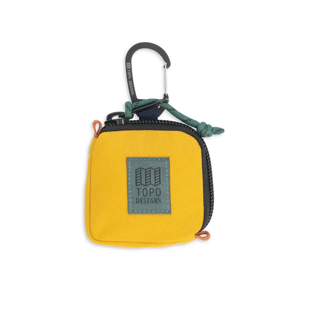 Topo Design Square Bag Mustard Front. This fun little clip bag is the perfect place to stash your headphones, cash and metro card as you rush to work.